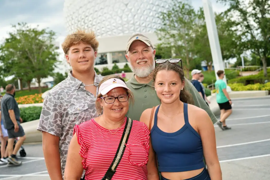 Family posing at a theme park.