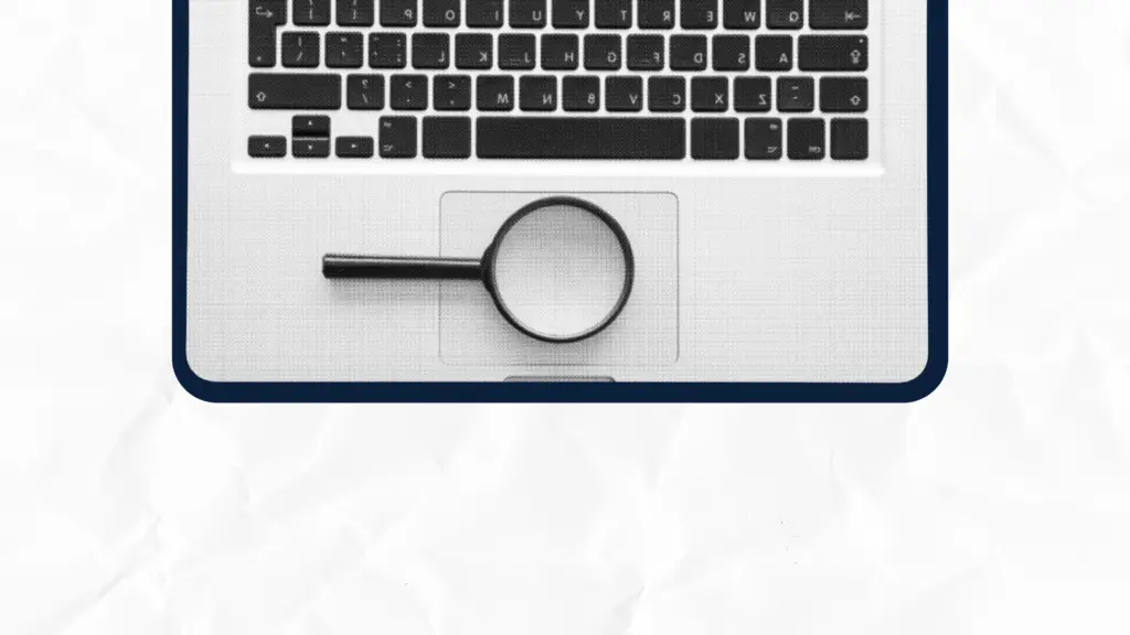 Laptop keyboard with a magnifying glass on the touchpad