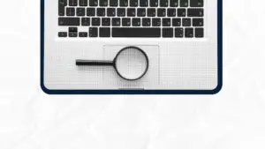 Laptop keyboard with a magnifying glass on the touchpad