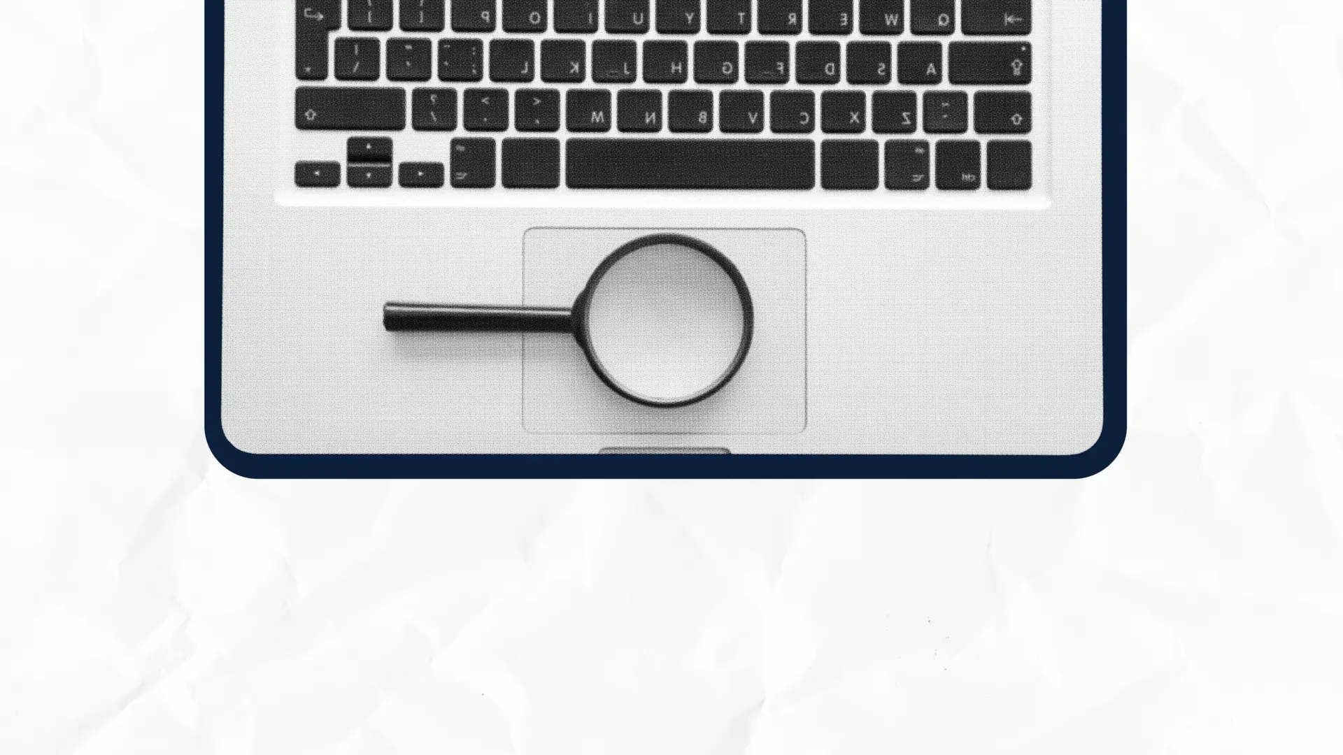 Laptop keyboard with a magnifying glass on the touchpad